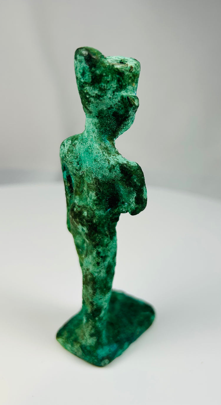 Small Egyptian bronze cult figure used as a temple votive offering in antiquity.
