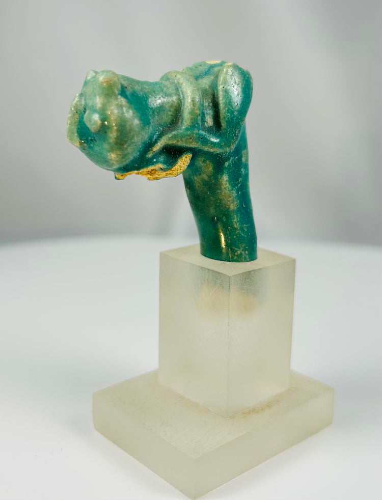 Ancient Egyptian turquoise faience handle fragment with Bastet cat representation.