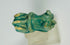 Ancient Egyptian Bastet-themed faience handle fragment with turquoise glaze.