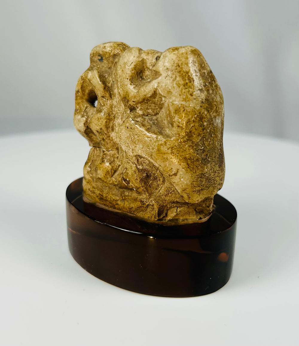 Ancient Egyptian limestone votive figure of a baboon linked to the god of wisdom Thoth.