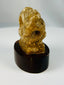 Late Period Egyptian limestone baboon votive figure mounted on display stand.