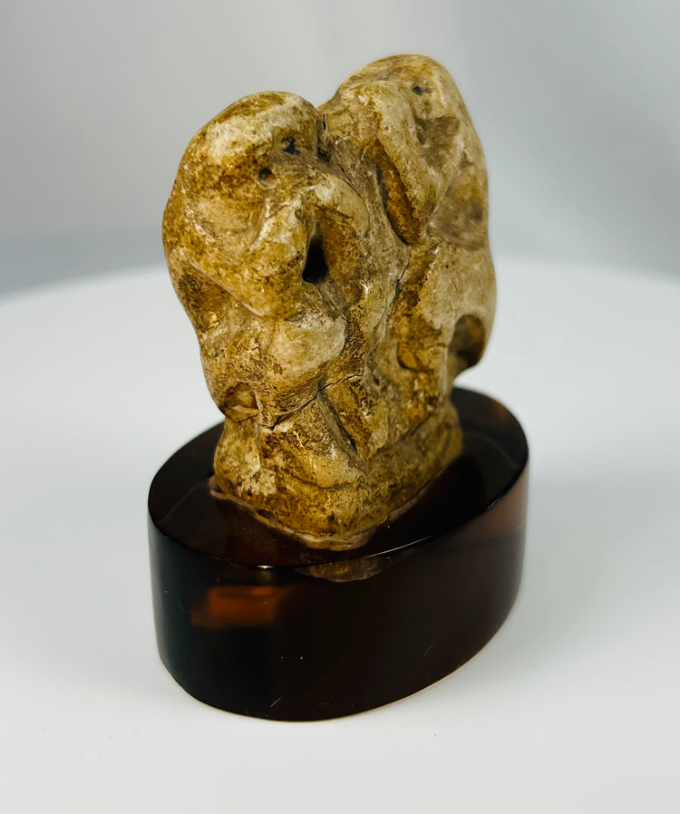 Ancient Egyptian carved baboon figure with stylized features associated with Thoth.