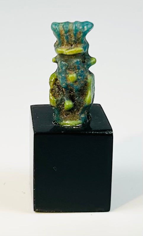 Egyptian faience amulet of the household protector Bes worn for protection.