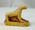 Small Egyptian limestone sculpture of a reclining lioness associated with Sekhmet.