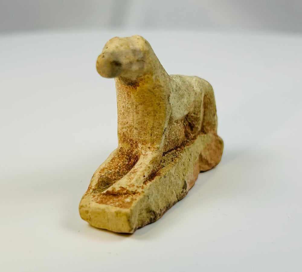 Late Period Egyptian limestone lioness statue symbolizing protection and solar power.