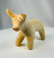 Persian Amlash terracotta animal sculpture with stylized horns and pierced eyes.