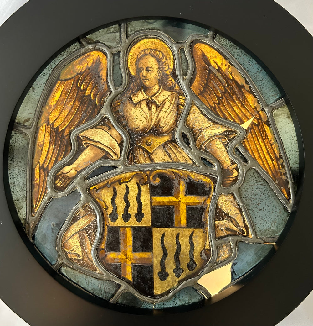 Decorative emblem with an angel and coat of arms on a dark background