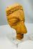 Classical terracotta theatre mask fragment from the Greco-Roman world mounted on display stand
