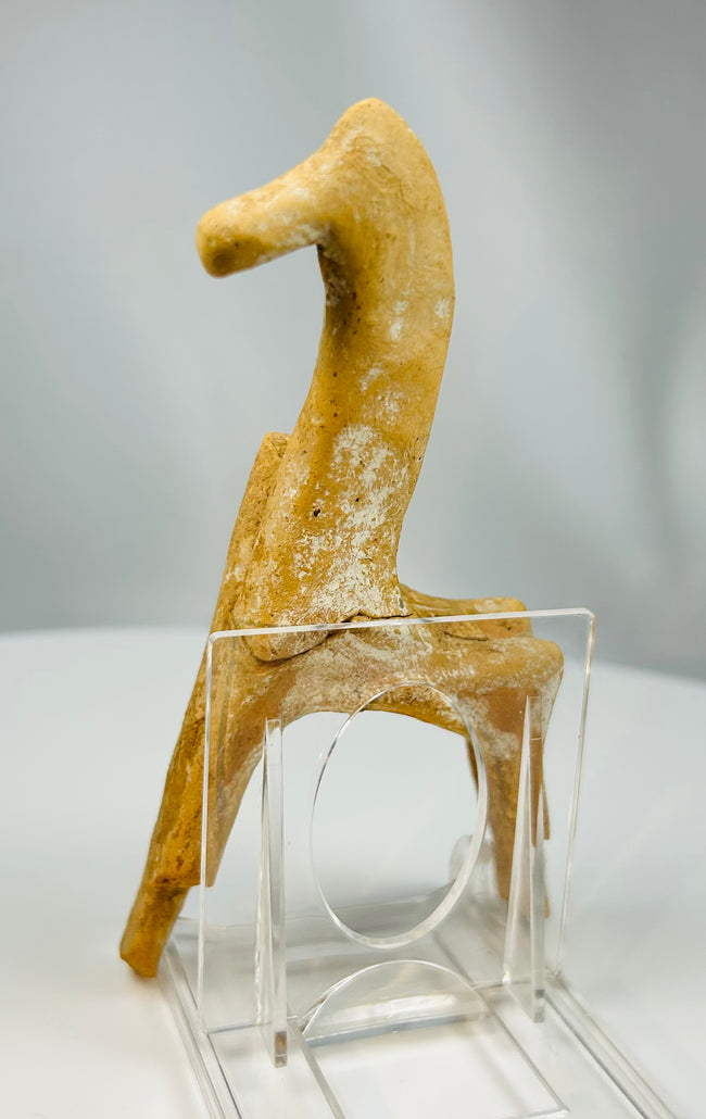 Terracotta horse artifact from ancient Greece used as a temple offering