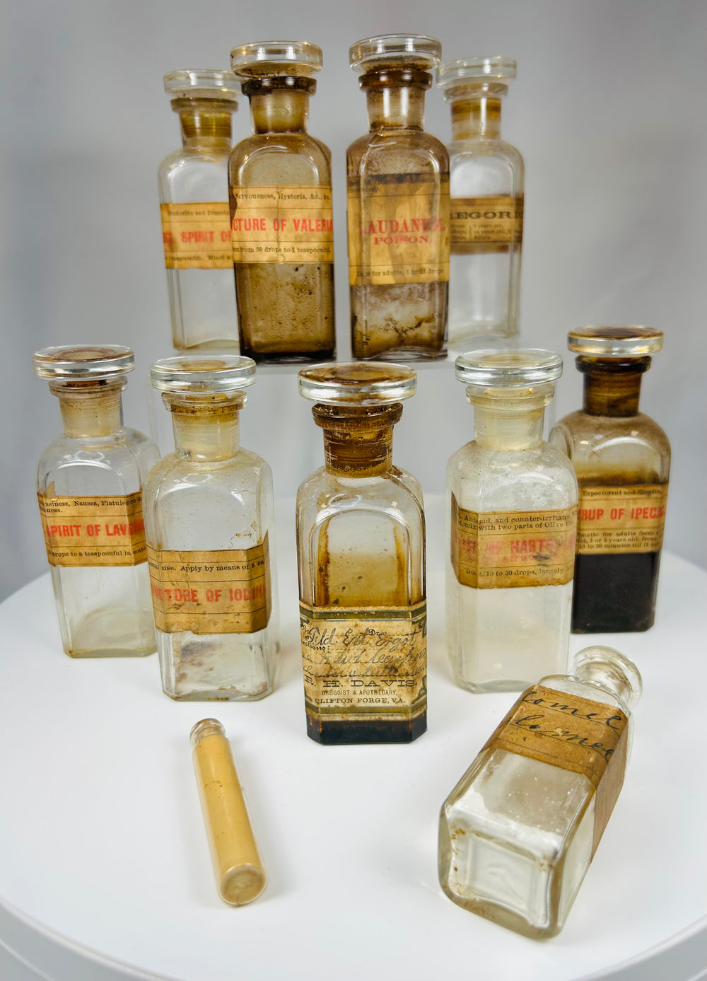 antique apothecary box with Victorian pharmacy bottles and handwritten prescriptions