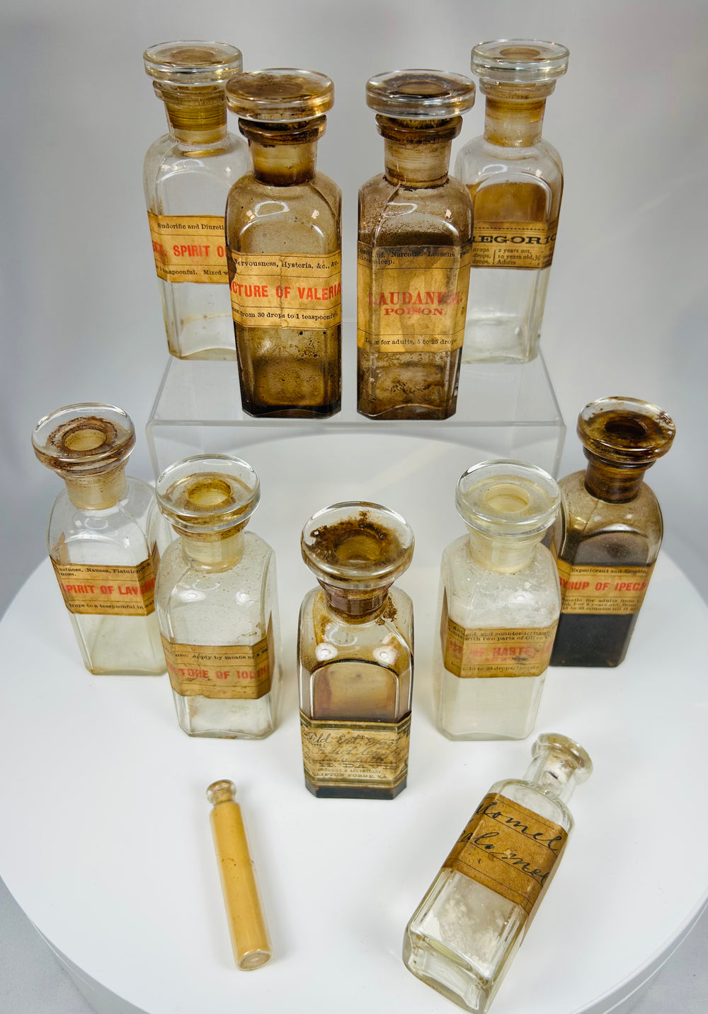 historical doctor’s medicine chest with glass apothecary bottles and cork stoppers