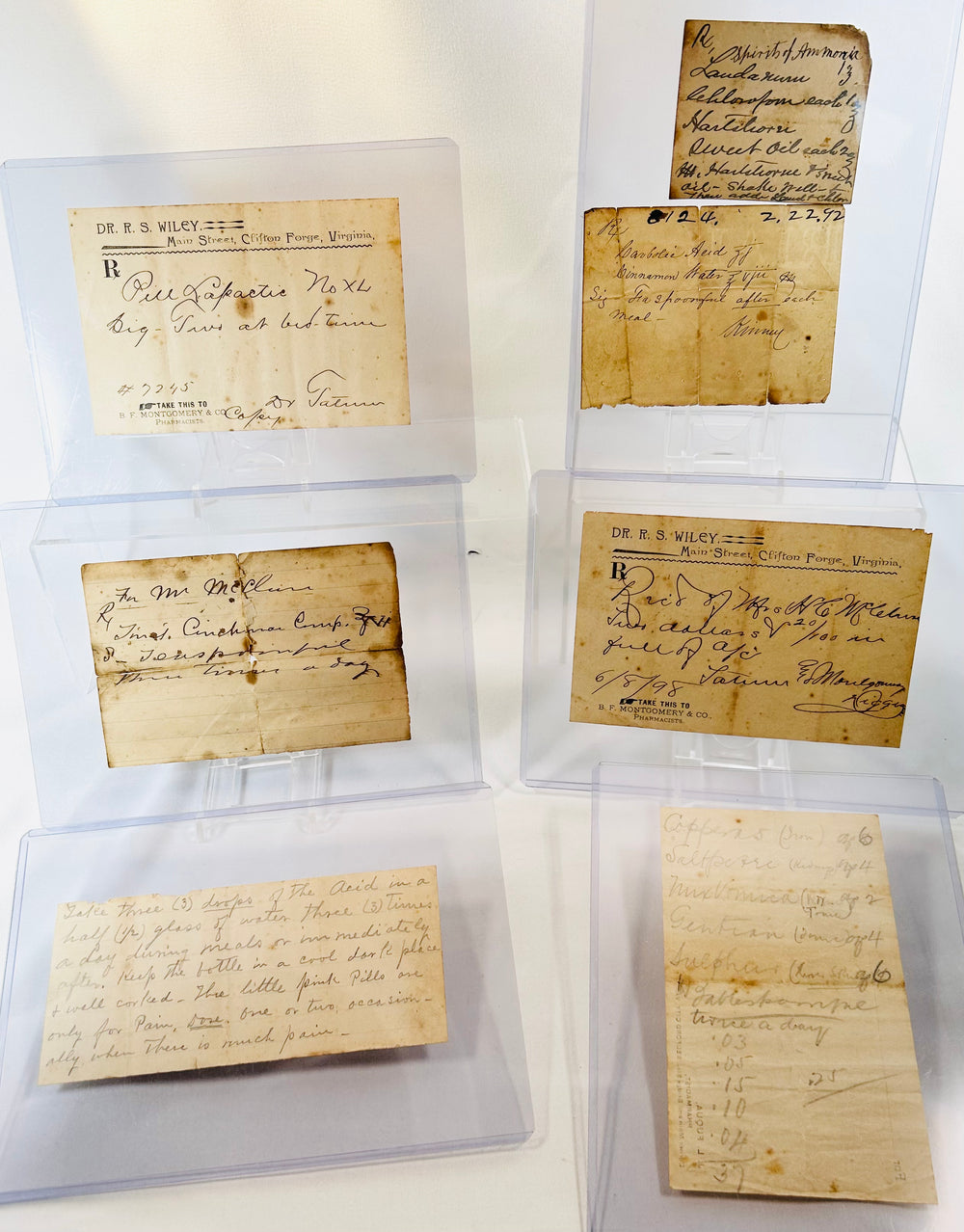 1800s traveling apothecary box containing glass bottles and pharmaceutical notes