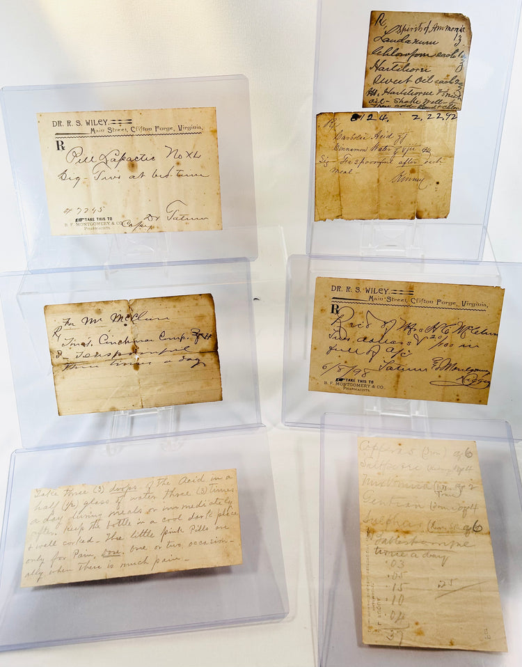 1800s traveling apothecary box containing glass bottles and pharmaceutical notes