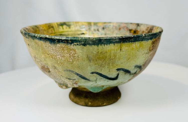 Antique Islamic Raqqa ware bowl with vegetal motifs and decorative border