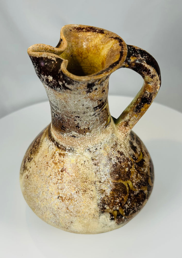 Medieval Persian pottery ewer with Kufic style inscription band around the neck