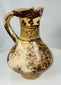 Medieval Islamic ceramic ewer with strap handle and trefoil pouring spout