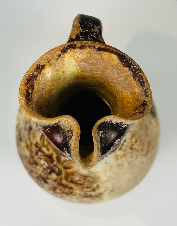 Persian Seljuk pottery vessel with manganese painted ornament beneath glaze