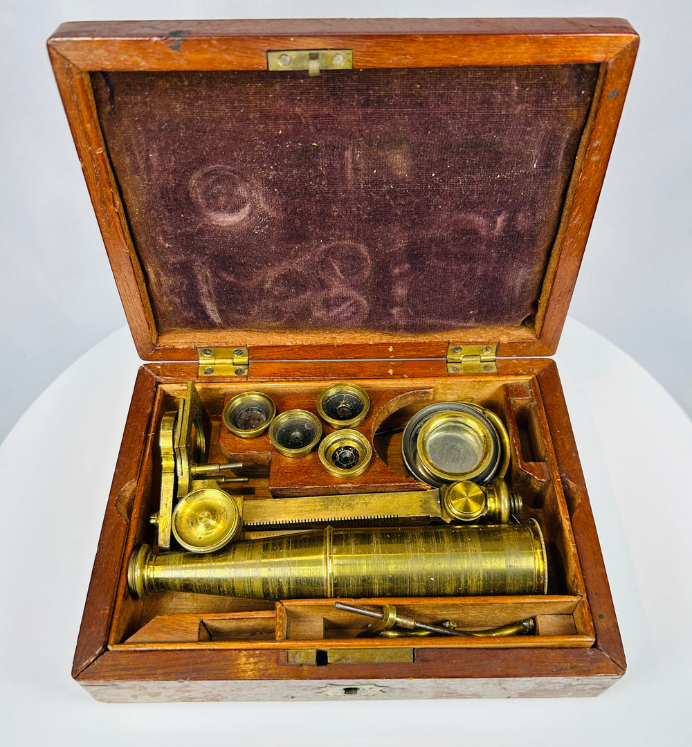 antique Gould type microscope with brass body and wooden storage box