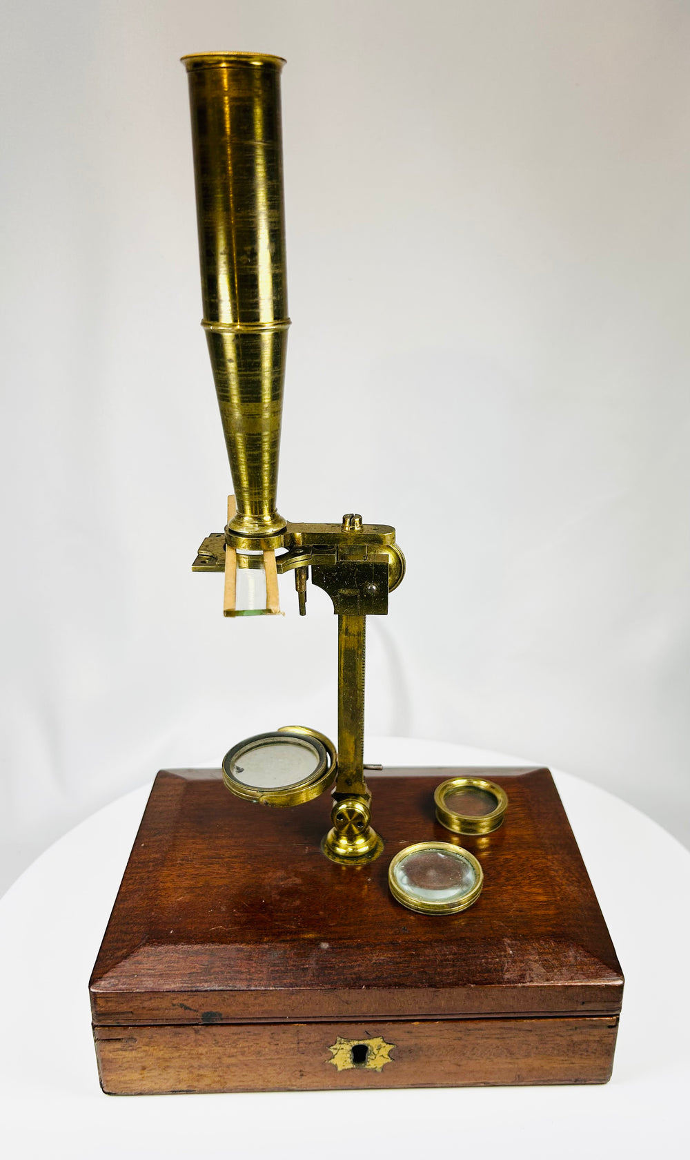 antique scientific microscope instrument in mahogany storage case