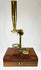 Victorian era brass microscope with bullseye condenser and mirror
