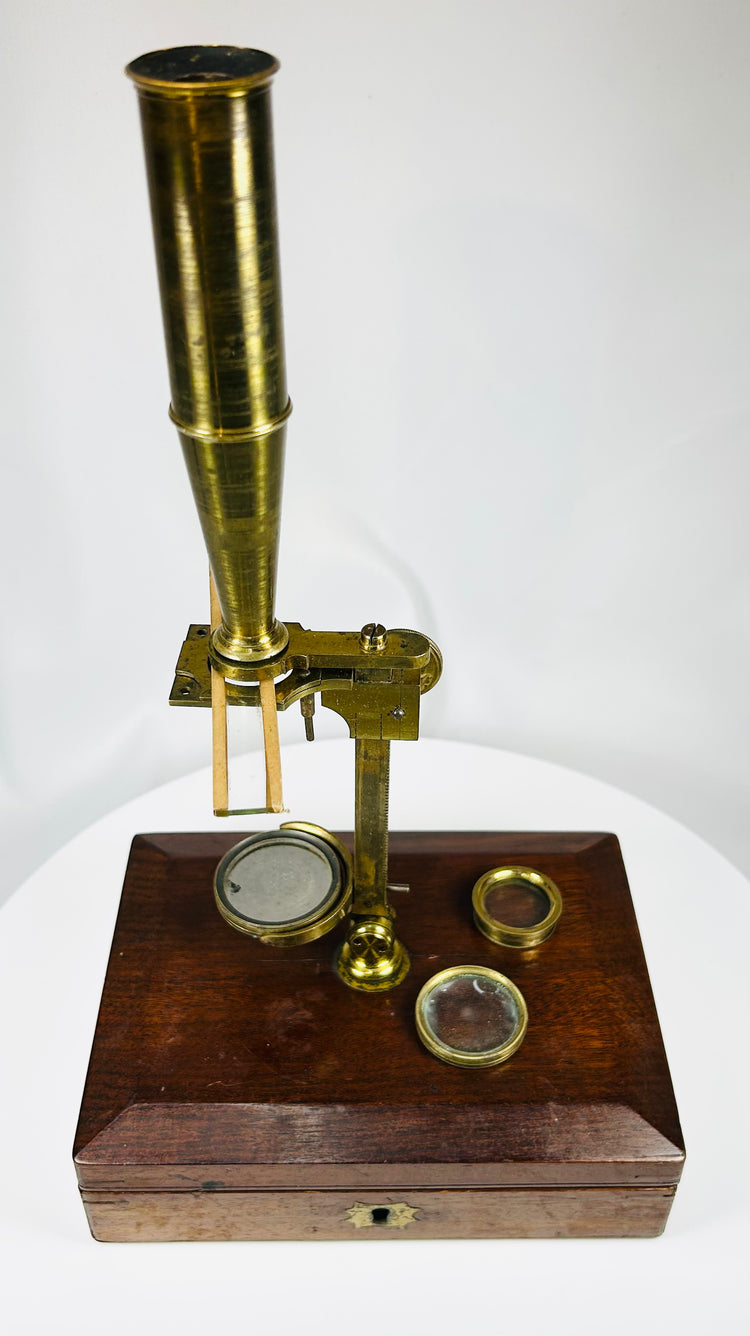 early scientific microscope with interchangeable button objective lenses