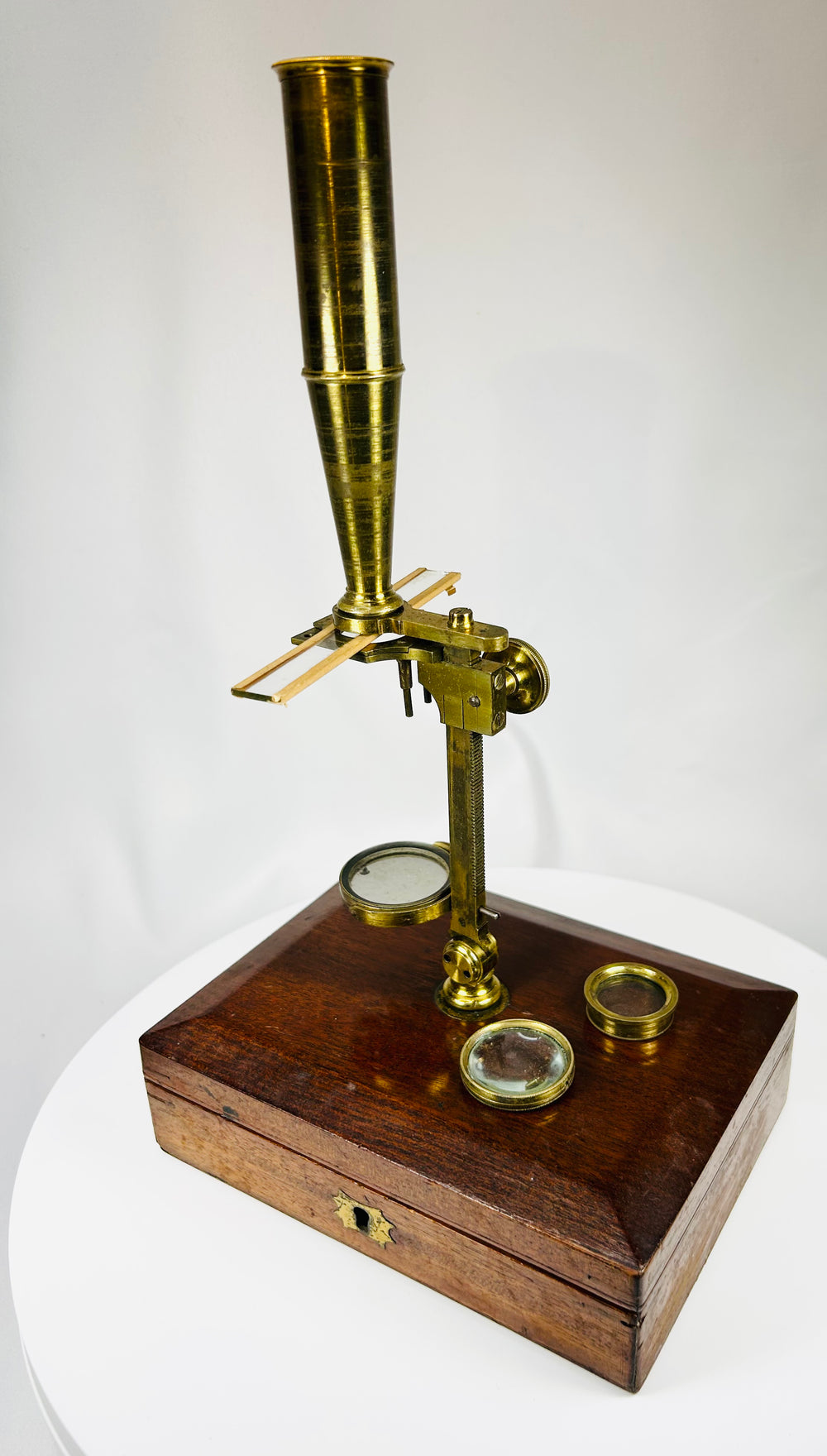 Gould style brass microscope designed to mount on its case lid