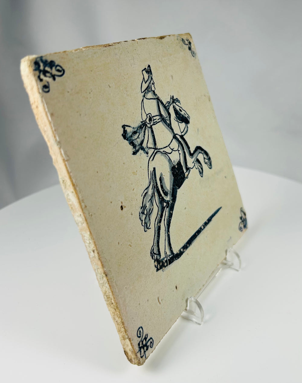 antique Dutch fireplace tile with hand painted rider on horseback