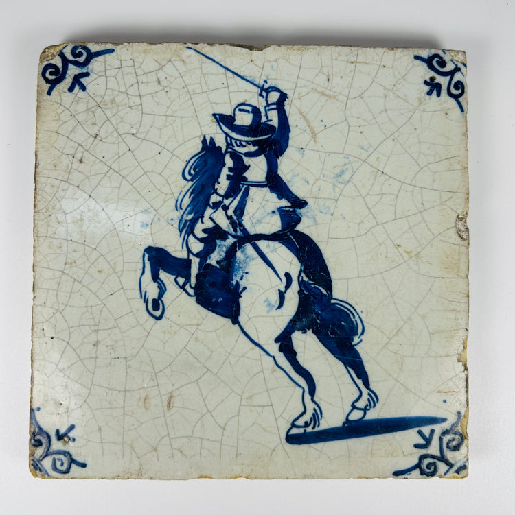 17th–18th century Delftware tile depicting rider raising sword