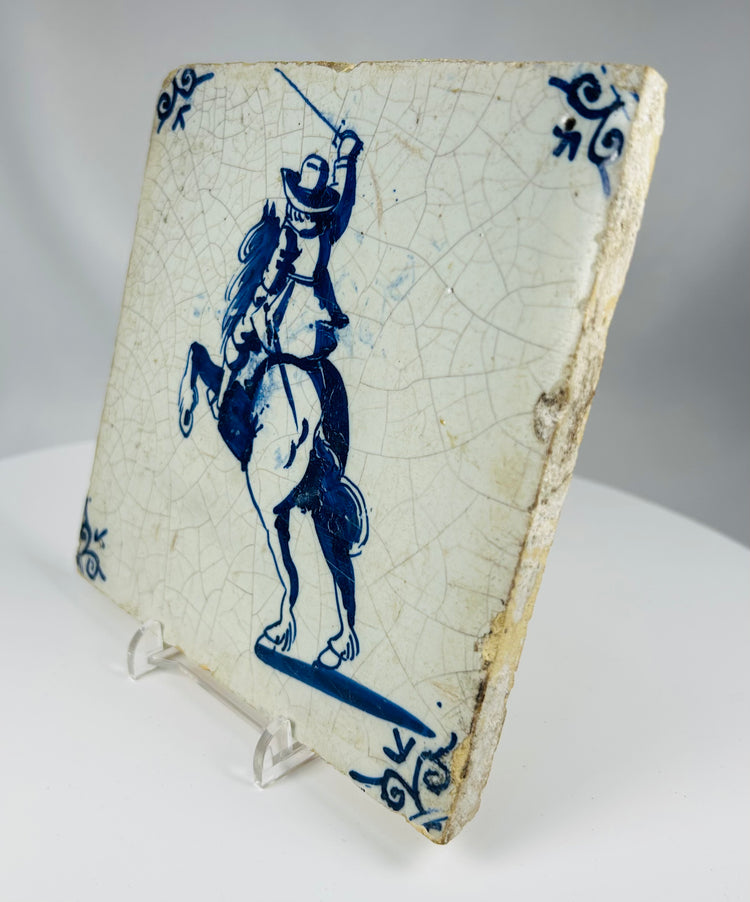 Dutch Delftware fireplace tile featuring mounted cavalry figure