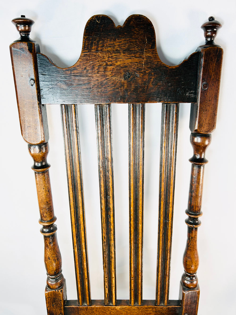 Late 17th century provincial oak chair with plank seat and heavy frame construction