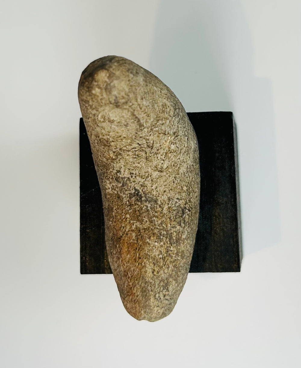 Pre-Columbian hand-shaped stone tool crafted using traditional pecking and grinding techniques