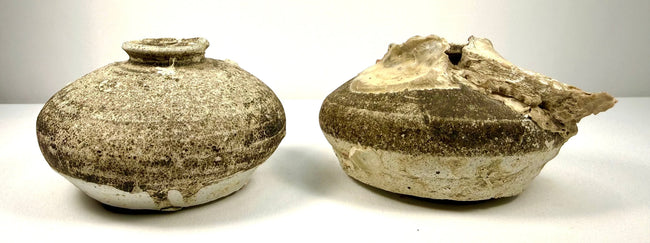 Ancient Chinese shipwreck pottery consisting of two Ming Dynasty jarlets with natural mussel and barnacle accretions from prolonged underwater submersion.