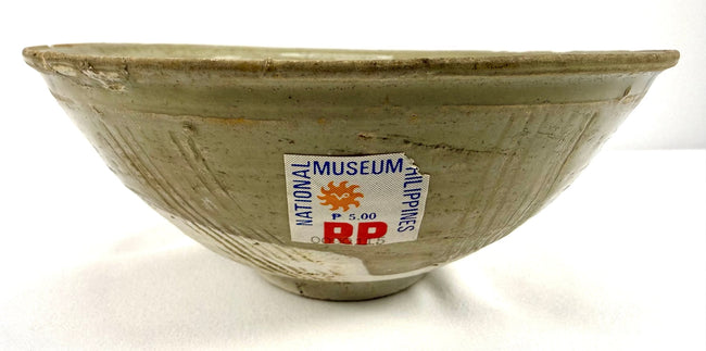 Ancient Song Dynasty celadon ware bowl measuring approximately 6.75 inches in diameter, featuring a glazed interior and traditional incised floral decoration.