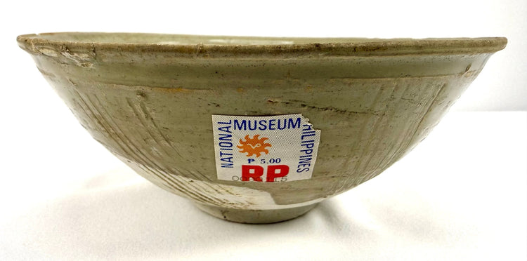Ancient Song Dynasty celadon ware bowl measuring approximately 6.75 inches in diameter, featuring a glazed interior and traditional incised floral decoration.