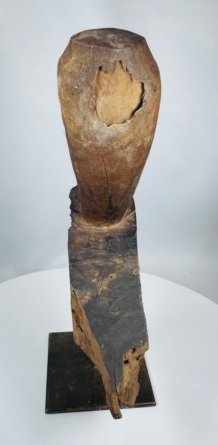 Southeast Asian spiritual hardwood carving mounted on a metal stand with aged patina