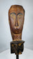Southeast Asian tribal wooden ceremonial figure fragment mounted on a custom display stand