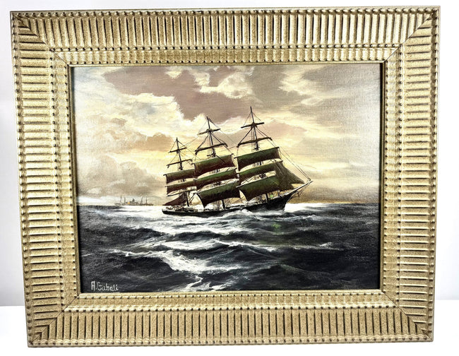 Signed Alfred Gabali marine painting depicting ships passing at sea beneath an atmospheric sky, reflecting the artist’s Cape Cod maritime influences.