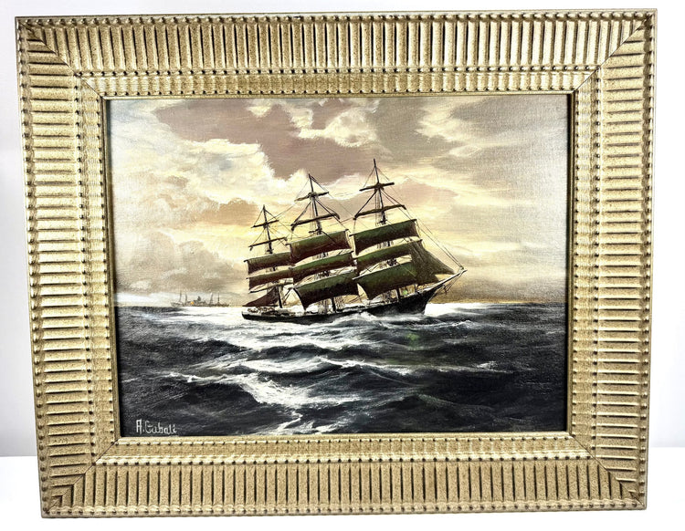 Signed Alfred Gabali marine painting depicting ships passing at sea beneath an atmospheric sky, reflecting the artist’s Cape Cod maritime influences.