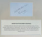Handwritten inscription above an identification panel describing the history of the attributed Egyptian mummy wrappings.