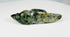 Pre-Columbian greenstone amulet depicting stylized animal figure with incised details