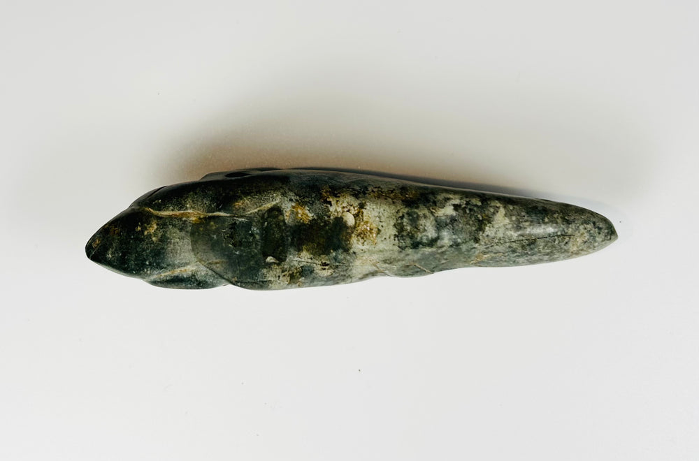 Pre-Columbian jade-like animal carving with polished surface and suspension hole