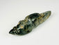 Ancient Mesoamerican jade-like carved animal pendant with polished surface