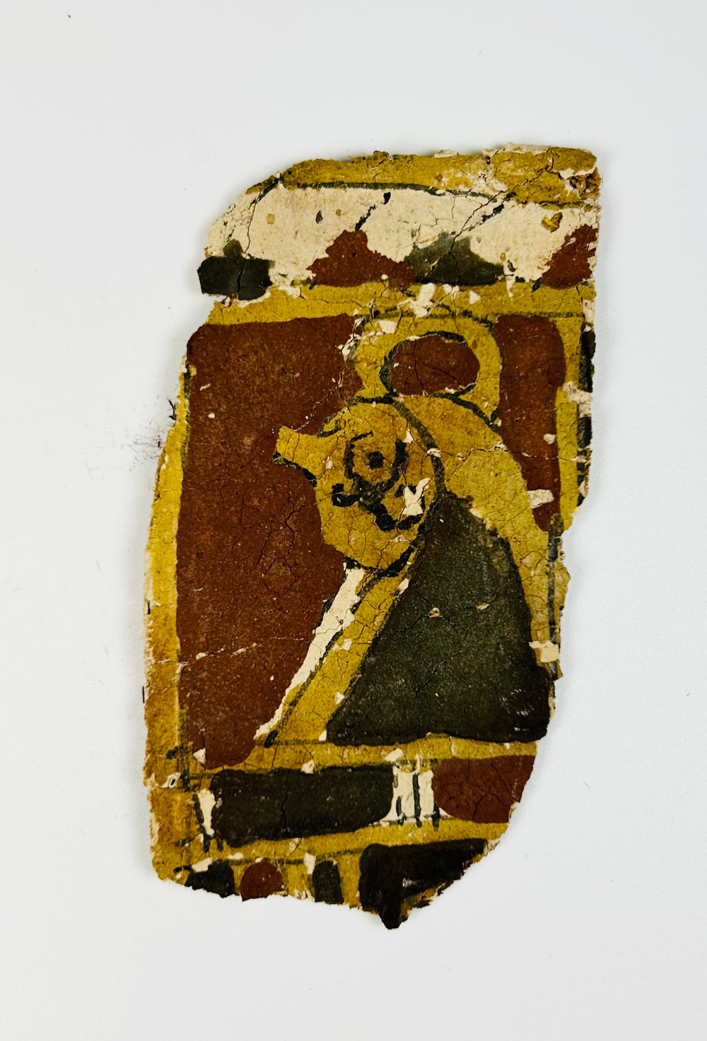 Egyptian coffin fragments with red, ochre, and black painted decoration