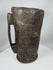Himalayan carved hardwood vessel with decorative incised bands and worn utilitarian finish