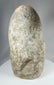 Early Near Eastern limestone idol with patinated surface and compact body
