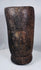 Hand-carved Tibetan hardwood vessel featuring aged cracks, tool marks, and integral side handle