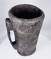 Rustic Tibetan carved hardwood container with integral handle and aged utilitarian surface