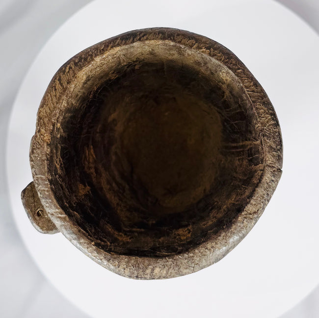 Antique Nepal or Tibet wooden domestic vessel displaying extensive age wear and natural wood texture