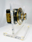 Antique safe lock display showing brass dial and exposed mechanical system