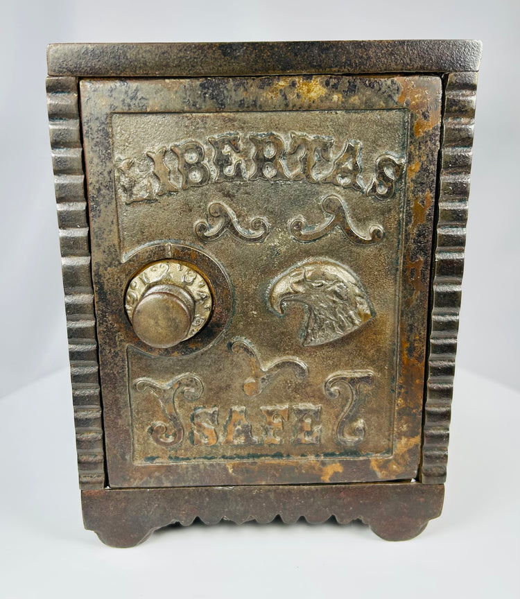 Vintage American cast iron safe bank with ornate Victorian detailing